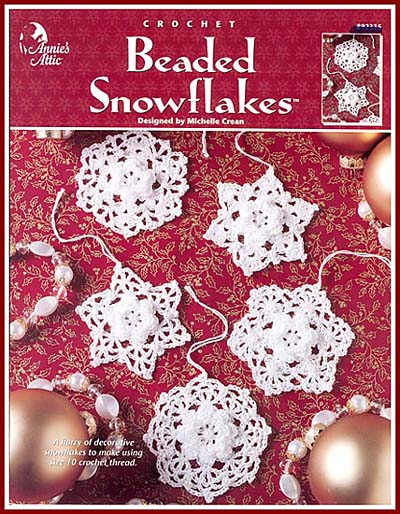 These crocheted snowflakes have a rose center and pearl bead accents.