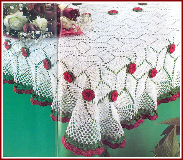 The Rose Banquet Tablecloth is crocheted using red, green, and white size 10 crochet cotton.