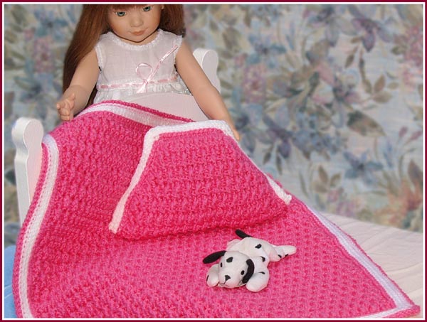 Your little girl's favorite 18 inch or baby doll can cuddle up with her very own afghan and TV pillow!