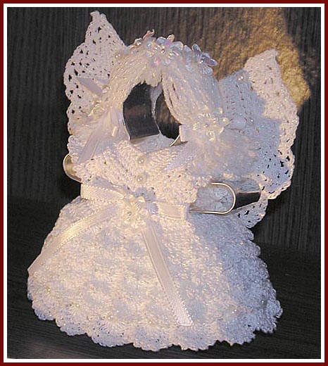 Aunt Irma's Snow Angel is crocheted of pearlized crochet cotton on a cookie cutter base.